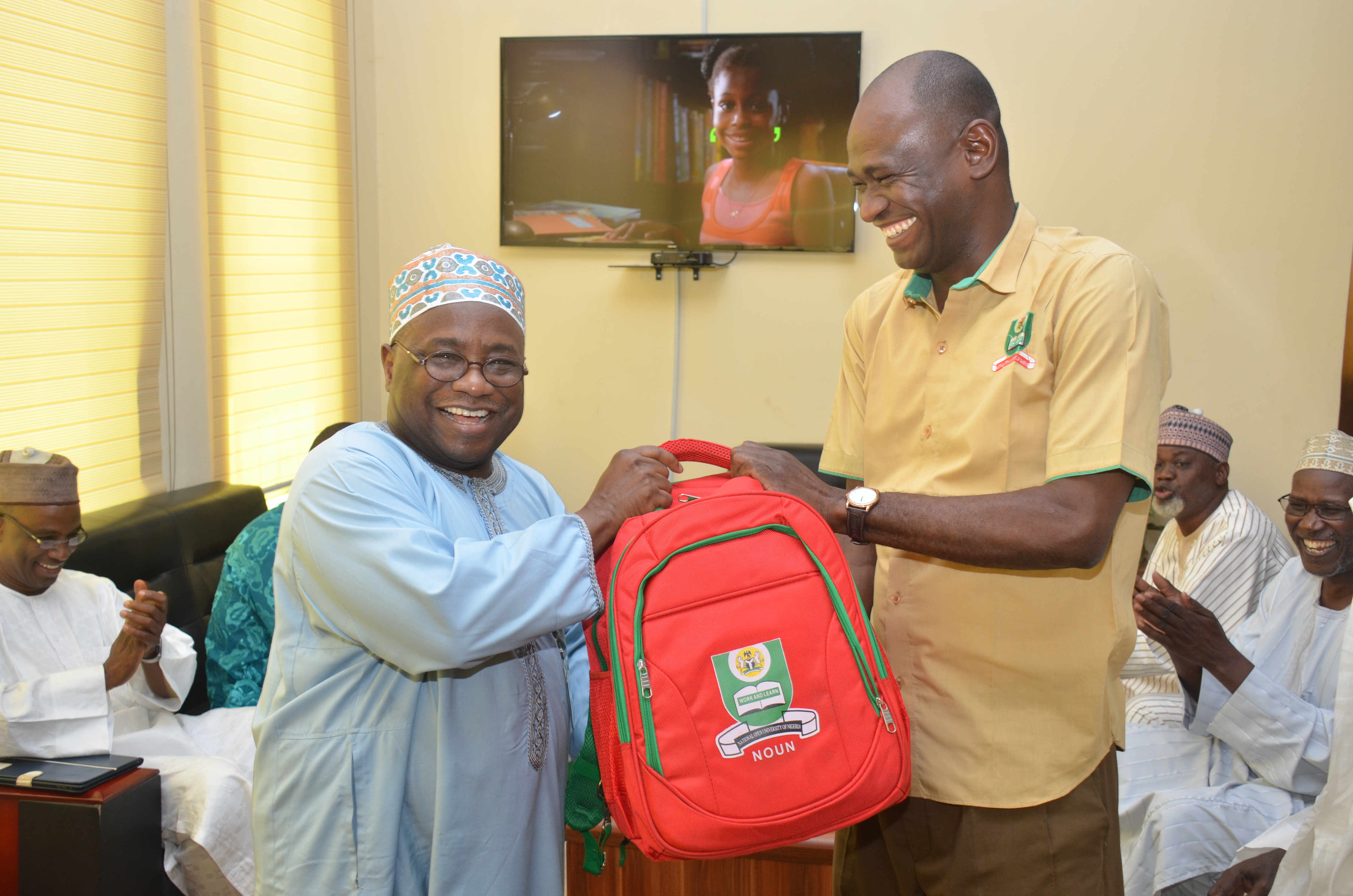 Prof. Abdalla Uba Adamu VC, NOUN with Prof Godwin Akper receiving award